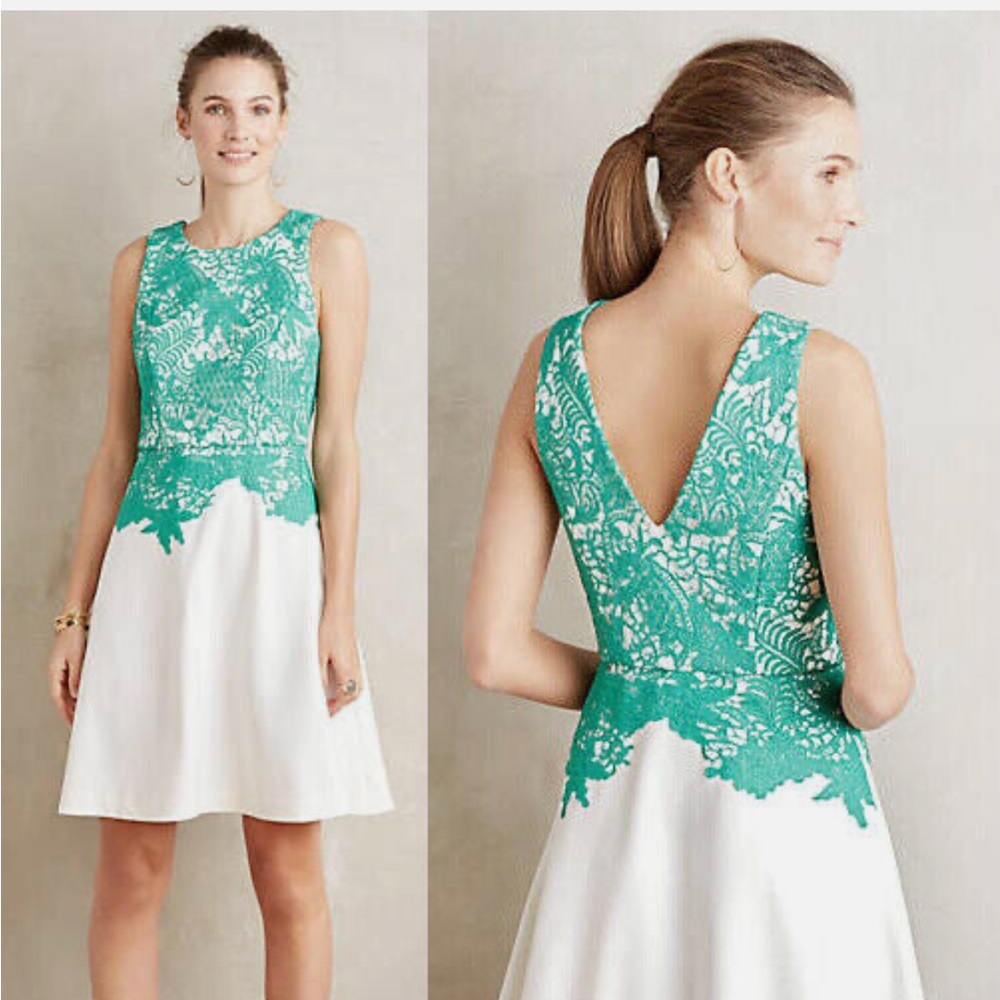 White dress with green lace overlay
